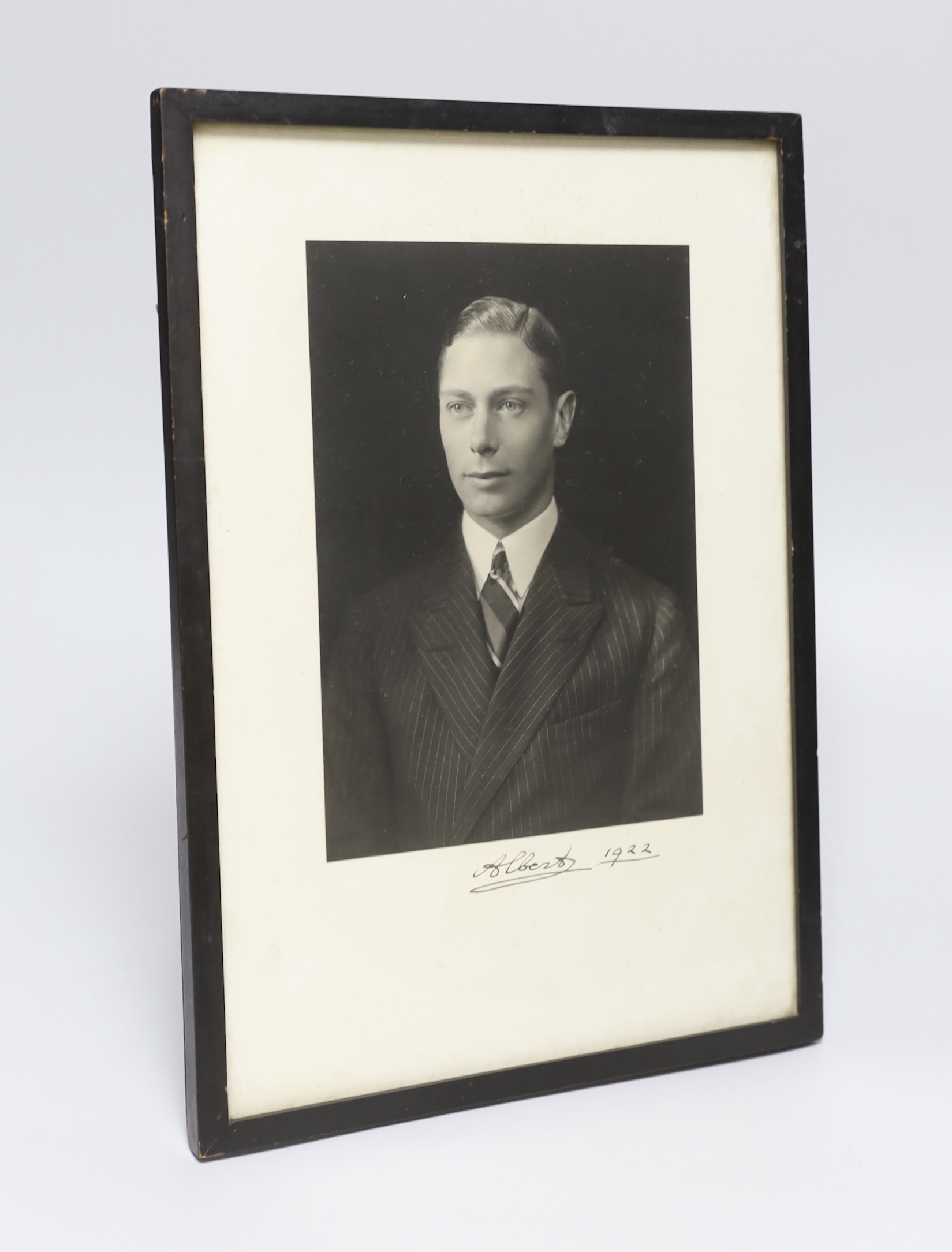 A vintage black and white framed photograph of King George VI, signed and dated Albert 1922, impressed Vandyn London, overall 30cm x 21.5cm